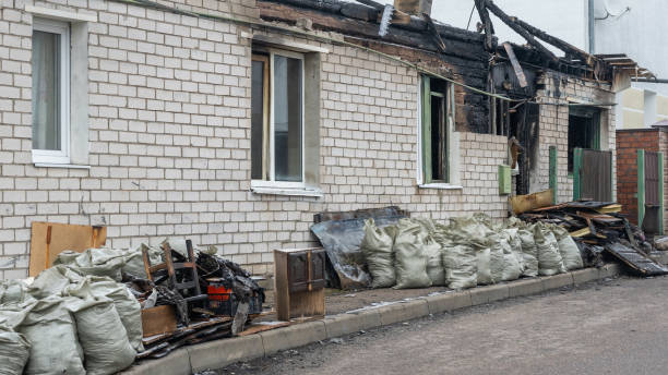 Professional Emergency Fire Cleanup technician working in Plano, KY